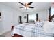 Cozy bedroom with natural light and neutral colors, featuring ceiling fan and bed at 1621 Dixie Rd, Covington, GA 30014