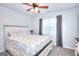 Neutral bedroom with white accents, a comfy bed, and a ceiling fan for comfort at 1621 Dixie Rd, Covington, GA 30014