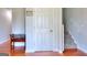 Bright hallway with hardwood floors, staircase, and convenient access to other areas at 1621 Dixie Rd, Covington, GA 30014