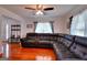 Spacious living room showcasing hardwood floors, a sectional sofa, and natural light at 1621 Dixie Rd, Covington, GA 30014