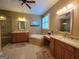 Elegant bathroom with dual vanities, soaking tub, and separate glass-enclosed shower at 511 Bonneset Ct, Canton, GA 30114