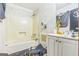 Bathroom with a bathtub/shower combo and single sink vanity at 870 The Cir, Lawrenceville, GA 30043