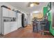 View of kitchen from the bar top featuring a stainless refrigerator, and cabinetry, plus barstool seating at 870 The Cir, Lawrenceville, GA 30043