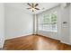 A well-lit bedroom features hardwood floors and a ceiling fan at 1363 Penhurst Dr, Lawrenceville, GA 30043
