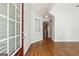 Welcoming foyer with hardwood floors, a decorative niche, and a view into the living spaces at 1363 Penhurst Dr, Lawrenceville, GA 30043