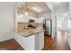 Stylish kitchen featuring granite countertops, stainless steel appliances, and pendant lighting at 1363 Penhurst Dr, Lawrenceville, GA 30043