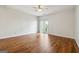 Spacious living room with hardwood floors, ceiling fan, and sliding glass doors for natural light at 1363 Penhurst Dr, Lawrenceville, GA 30043