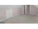 Spacious attic featuring neutral walls and carpet and a storage closet at 445 Royal St, Mcdonough, GA 30253