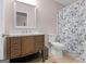 Bathroom with vanity, mirror, and shower with decorative blue and white shower curtain at 445 Royal St, Mcdonough, GA 30253