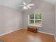 Bedroom with hardwood floors, ceiling fan, vaulted ceiling, and a sunlit window at 445 Royal St, Mcdonough, GA 30253