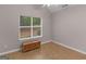 Bedroom featuring hardwood floors, a sunlit window, and neutral-colored walls at 445 Royal St, Mcdonough, GA 30253