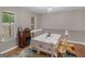 Cozy dining area with white table, wood floors, and bright natural light at 445 Royal St, Mcdonough, GA 30253