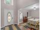 Inviting foyer features a decorative front door, high ceilings, and views into the dining area at 445 Royal St, Mcdonough, GA 30253