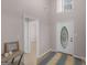 Inviting foyer features a decorative front door, high ceilings, and tile floors at 445 Royal St, Mcdonough, GA 30253