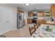 Eat-in kitchen features stainless steel refrigerator, gas range, and ample cabinet space at 445 Royal St, Mcdonough, GA 30253