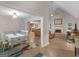 Open-concept living area with fireplace, tile floors, dining area, and a view to kitchen at 445 Royal St, Mcdonough, GA 30253