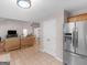 Open concept living room and stainless steel refrigerator, creating an inviting space at 445 Royal St, Mcdonough, GA 30253