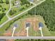 Aerial view of new home construction on acreage in a wooded area at 715 Colvin Dr, Locust Grove, GA 30248