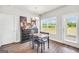 Cozy dining area with modern table set and a black accent dresser at 715 Colvin Dr, Locust Grove, GA 30248