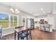 View of dining area with modern table set, stainless appliances, and window view at 715 Colvin Dr, Locust Grove, GA 30248