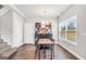 View of dining room featuring a table, a black accent dresser, and a window at 715 Colvin Dr, Locust Grove, GA 30248