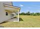 Covered back patio with an open backyard and view of trees at 715 Colvin Dr, Locust Grove, GA 30248