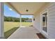 Covered back patio with an open backyard and view of trees at 715 Colvin Dr, Locust Grove, GA 30248