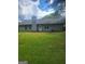 Home featuring a spacious backyard with lush green grass and privacy at 324 Cynthia Ct, Jonesboro, GA 30238