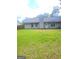 Home featuring a spacious backyard with lush green grass and privacy at 324 Cynthia Ct, Jonesboro, GA 30238
