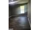 Bedroom with wood laminate floors, gray walls, ceiling fan and window with horizontal blinds at 324 Cynthia Ct, Jonesboro, GA 30238
