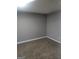 Bedroom featuring plush carpeting, neutral walls, and essential outlets for a cozy retreat at 324 Cynthia Ct, Jonesboro, GA 30238
