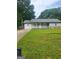 Charming single-story home with a well-manicured lawn and welcoming front porch at 324 Cynthia Ct, Jonesboro, GA 30238