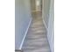Hallway featuring wood flooring and neutral paint at 324 Cynthia Ct, Jonesboro, GA 30238