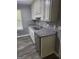 Updated kitchen showcasing granite countertops, stainless steel appliances, and white cabinetry at 324 Cynthia Ct, Jonesboro, GA 30238
