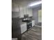 Well-equipped kitchen with stainless steel appliances, granite counters, and ample storage at 324 Cynthia Ct, Jonesboro, GA 30238