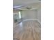 Open living room featuring wood flooring, fireplace, natural light and ceiling fan at 324 Cynthia Ct, Jonesboro, GA 30238