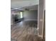 Open living room featuring wood flooring, fireplace, natural light and ceiling fan at 324 Cynthia Ct, Jonesboro, GA 30238