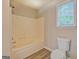 Clean, bright bathroom with tub/shower combination and modern toilet at 126 Usher Ln, Covington, GA 30016