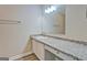 Bright bathroom features a sink with a granite countertop at 126 Usher Ln, Covington, GA 30016