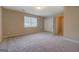 Spacious bedroom features neutral tones, soft carpeting, and ample closet space for comfortable living at 126 Usher Ln, Covington, GA 30016