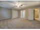 Large carpeted bedroom provides ample space and natural light at 126 Usher Ln, Covington, GA 30016