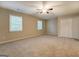 Spacious bedroom featuring a ceiling fan, windows, and a closet at 126 Usher Ln, Covington, GA 30016