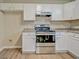A kitchen showcases stainless steel appliances and plenty of cabinet space at 126 Usher Ln, Covington, GA 30016