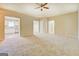 Spacious living room featuring neutral carpet and open access to the kitchen at 126 Usher Ln, Covington, GA 30016