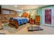 Cozy bedroom with a brick wall, a large bed, and a treadmill for at-home workouts at 3449 Archwood Dr, Doraville, GA 30340