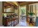 Cozy entryway featuring hardwood floors, a decorative cabinet, and a view to the outdoors at 3449 Archwood Dr, Doraville, GA 30340