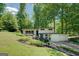 Attractive two-story home with a garage, complemented by lush landscaping and mature trees at 3449 Archwood Dr, Doraville, GA 30340