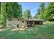Back exterior of the home with back patio and grill at 3449 Archwood Dr, Doraville, GA 30340