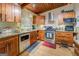 Well-equipped kitchen with stainless steel appliances, wood cabinets, and ample counter space for cooking at 3449 Archwood Dr, Doraville, GA 30340