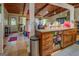 Open-concept kitchen and living space, featuring granite counters, wood cabinets, and access to the outdoors at 3449 Archwood Dr, Doraville, GA 30340